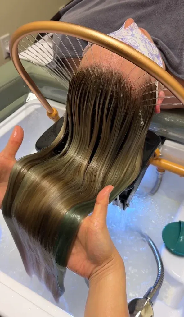Hair smoothed with Moroccan oil after a head spa blow-dry
